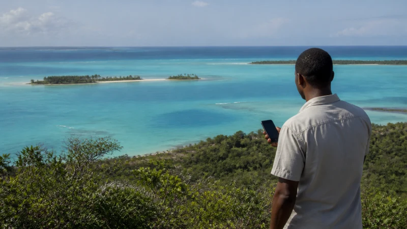 Traveller checking mobile coverage on a smartphone in Mozambique