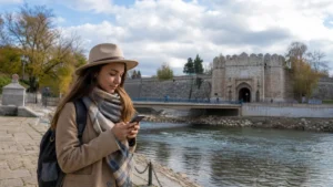 Traveller using a smartphone during internet in niš for tourists in Serbia.
