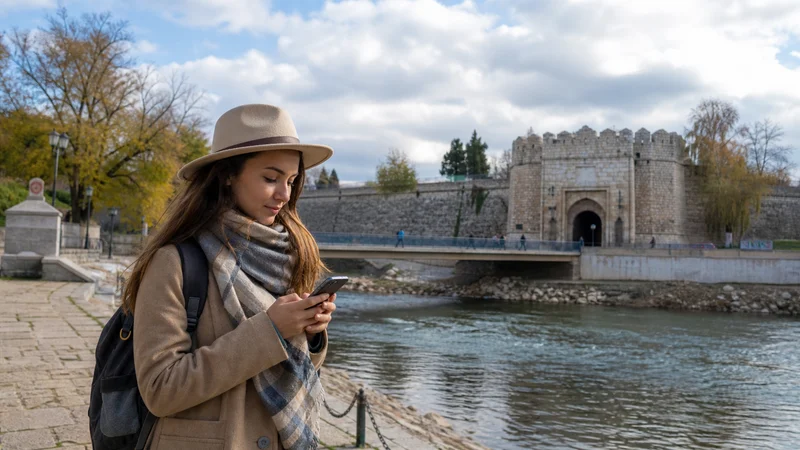 Traveller using a smartphone during internet in niš for tourists in Serbia.