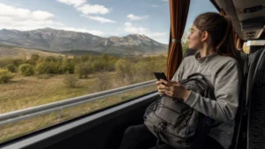 Traveller using a smartphone during north macedonia intercity bus wifi and mobile data guide in North Macedonia.