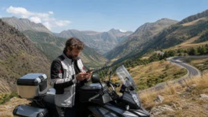 Traveller using a smartphone during north macedonia motorcycle trip in North Macedonia.
