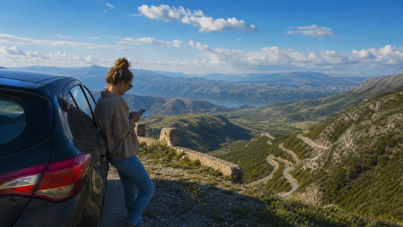 Traveller using a smartphone during north macedonia road trip mobile internet and esim guide in North Macedonia.