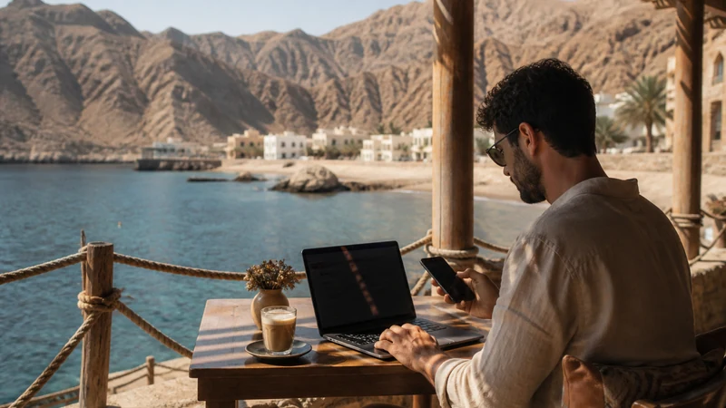 Remote worker with laptop at an omani coastal café
