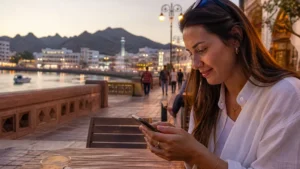 Traveller using a smartphone during short-trip visitor in Muttrah