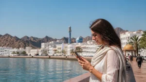 Traveller using a smartphone during winter visitor in sunny Oman