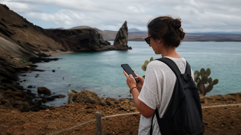 Traveller using a smartphone in Ecuador for otavalo mobile internet
