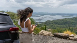 Traveller using a smartphone in Panama for panama esim for rental car