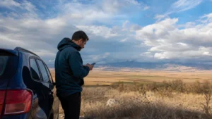 Traveller using a smartphone during mobile internet in pelagonia in North Macedonia.