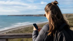 Traveller using a smartphone in Argentina for staying connected in puerto madryn