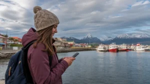 Traveller using a smartphone in Chile for staying connected in puerto natales