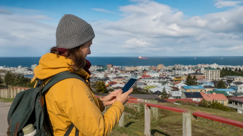 Traveller using a smartphone in Chile for mobile coverage around punta arenas