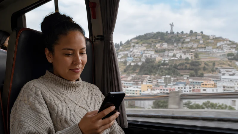 Traveller using a smartphone in Ecuador for quito airport to city internet