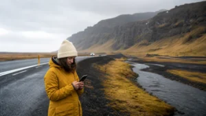 Traveller using a smartphone in Reykjavík
