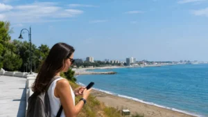 Traveller using a smartphone during romanian black sea coast in Romania.