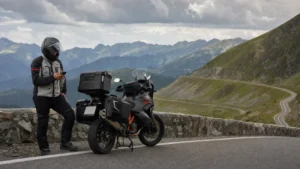 Traveller using a smartphone during romania motorcycle trip in Romania.