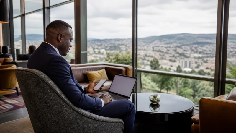 Business traveller working online from a Kigali hotel lounge