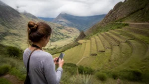 Traveller using a smartphone in Peru for sacred valley mobile internet