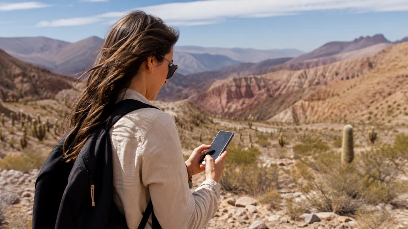 Traveller using a smartphone in Argentina for how to stay connected in salta