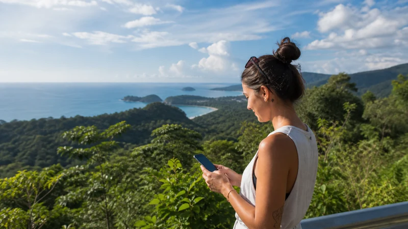 Traveller using a smartphone in Costa Rica for internet access between san josé and manuel antonio