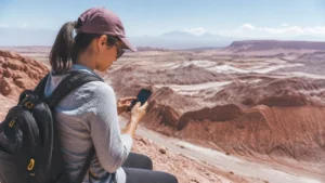 Traveller using a smartphone in Chile for what to expect from mobile data in san pedro de atacama