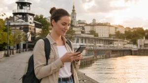 Traveller using a smartphone during solo travel in serbia in Serbia.