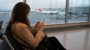 Traveller using a smartphone in Colombia for should you buy a sim card at bogotá airport?