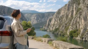 Traveller using a smartphone during skopje to matka canyon mobile internet in North Macedonia.