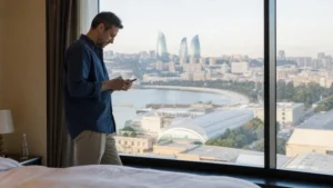 Traveller testing mobile data speed in a Baku cafe