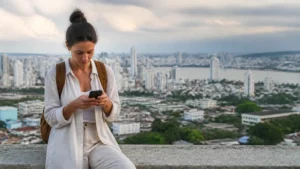 Traveller using a smartphone in Colombia for why your colombia esim feels slow — and what can help