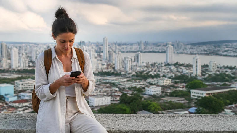 Traveller using a smartphone in Colombia for why your colombia esim feels slow — and what can help