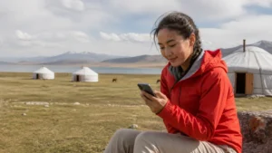 Traveller using a smartphone in Kyrgyzstan for song kul mobile internet