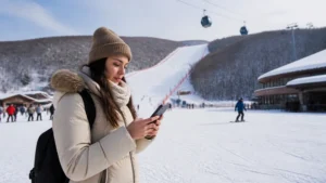 Traveller using mobile data at a South Korean ski resort
