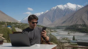 Traveller sharing phone data with a laptop in Tajikistan