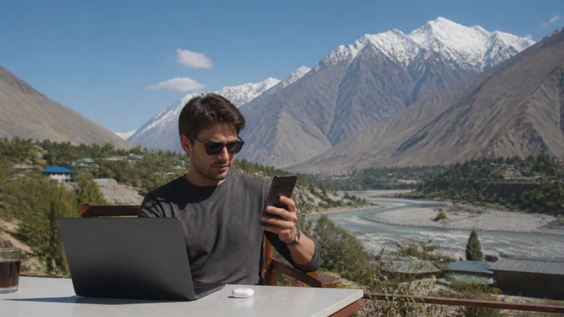 Traveller sharing phone data with a laptop in Tajikistan