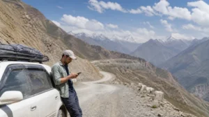 Traveller using a smartphone for tajikistan road trip mobile internet: esim and offline maps