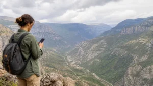 Traveller using a smartphone while using mobile internet near Tatev