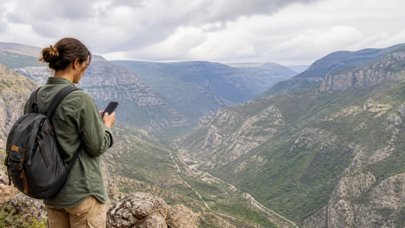 Traveller using a smartphone while using mobile internet near Tatev