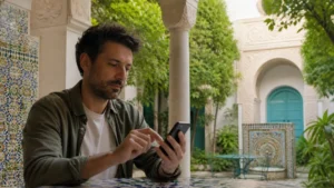 Traveller using a smartphone for Tunisia eSIM Android in Tunisia