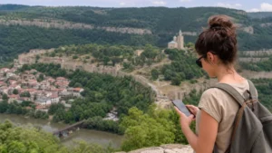 Traveller checking a smartphone above Veliko Tarnovo