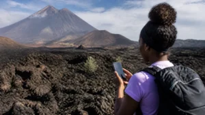 Traveller using mobile internet on Fogo Island, Cape Verde