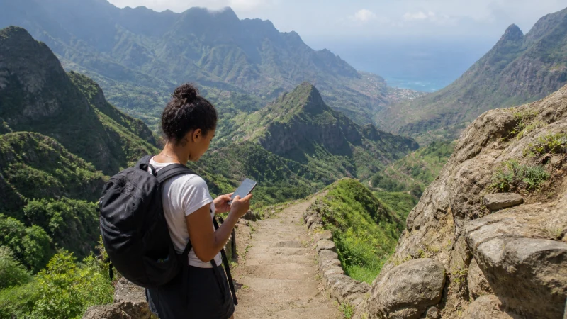 Traveller checking mobile coverage on Santo Antão, Cape Verde
