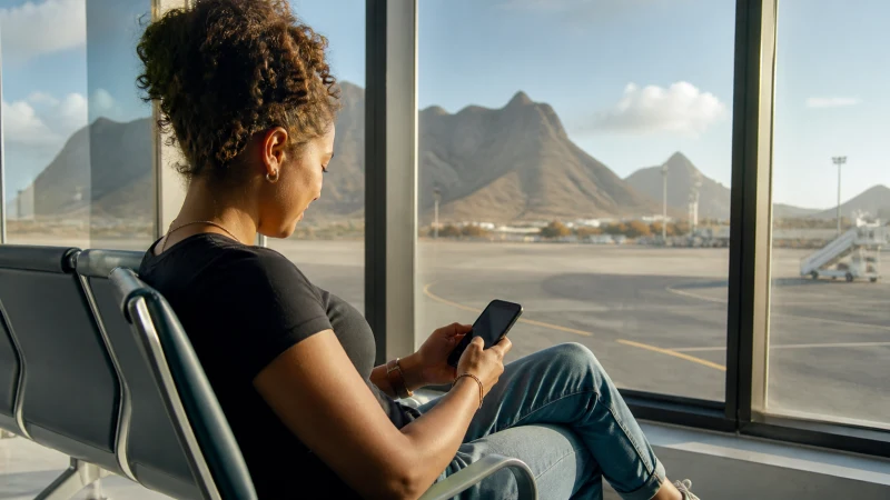 Traveller using WiFi at São Vicente Airport