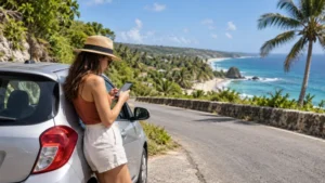 Traveller using mobile navigation beside a coastal road in Barbados